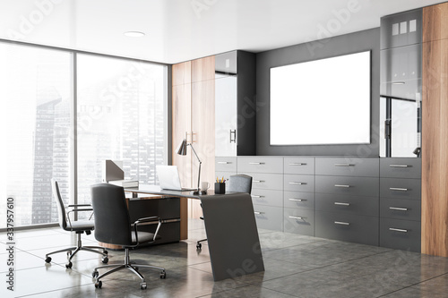 Gray and wooden CEO office corner with poster