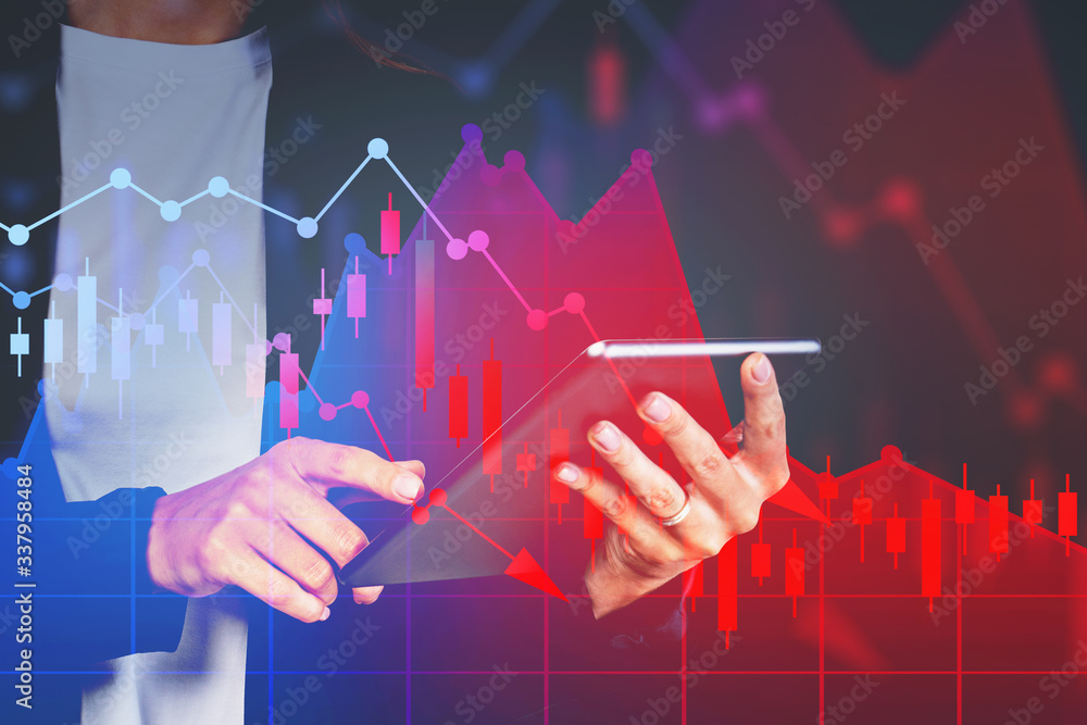 Hands of woman with tablet, falling graph Hands of woman with tablet, falling graph