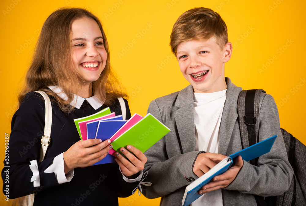 School supplies children need. Happy children hold note books. Little children back to school. Small children during school time. Education and study. Stationery shop. September 1 School supplies children need. Happy children hold note books. Little children back to school. Small children during school time. Education and study. Stationery shop. September 1