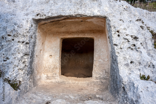 Prehistoric tombs in the Unesco site of Pantalica. Necropolis of Pantalica, Sortino, Syracuse, Sicily, Italy. photo
