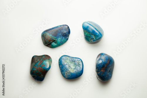 Blue shattuckite cabochon on the white background