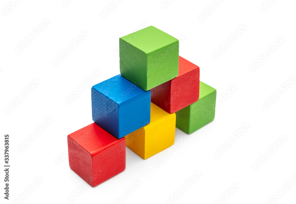 Pyramid from colorful wooden toy bricks on white. Pyramid from colorful wooden toy bricks on white.