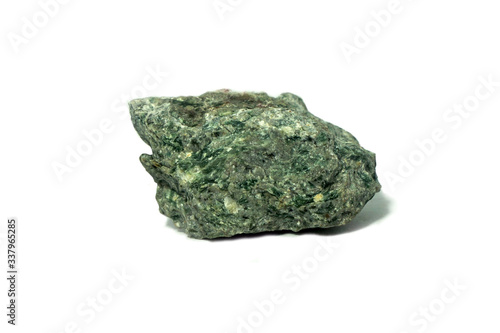Tuff isolated on a white background. Tuff is an igneous rock that contains the debris from an explosive volcanic eruption. There is noise and grain caused by the texture of stone.