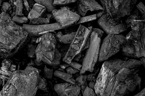 Black charcoal texture background, Natural wood charcoal. © saranyoo