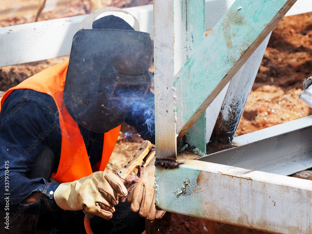 Welding work ,worker with protective welding metal on construction Welding work ,worker with protective welding metal on construction
