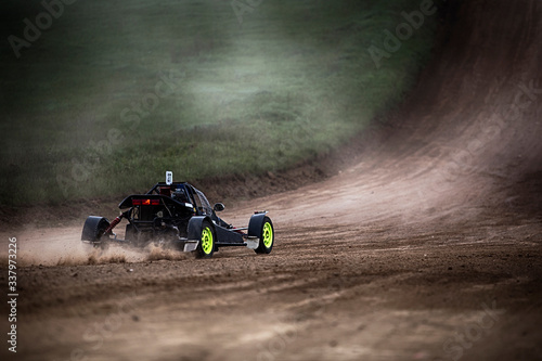 Racing sports car in dust clubs on the track , rally