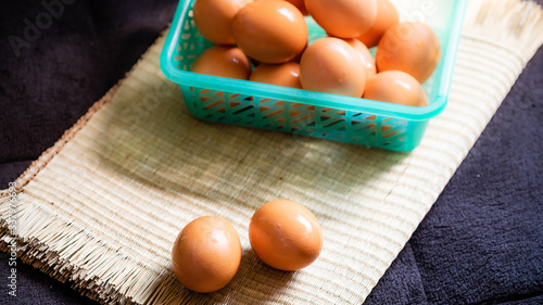 Chicken eggs with a black background, chicken eggs with natural light, chicken eggs are the food that every home needs, chicken eggs are very useful and protein.