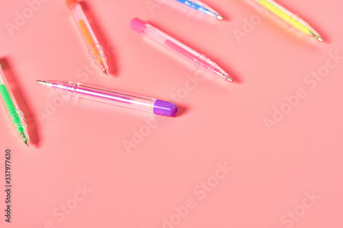 Workplace with stationery accessories on pink countertop. Business or back to school concept. Secretaries workspace