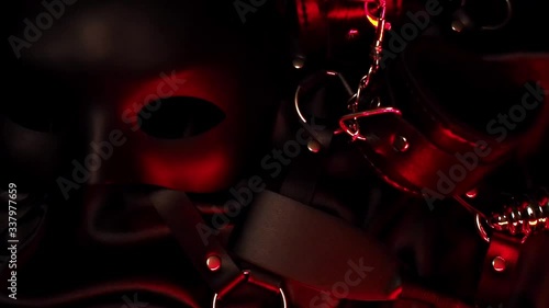 Leather whip, handcuffs, mask and metal anal plug for BDSM sex