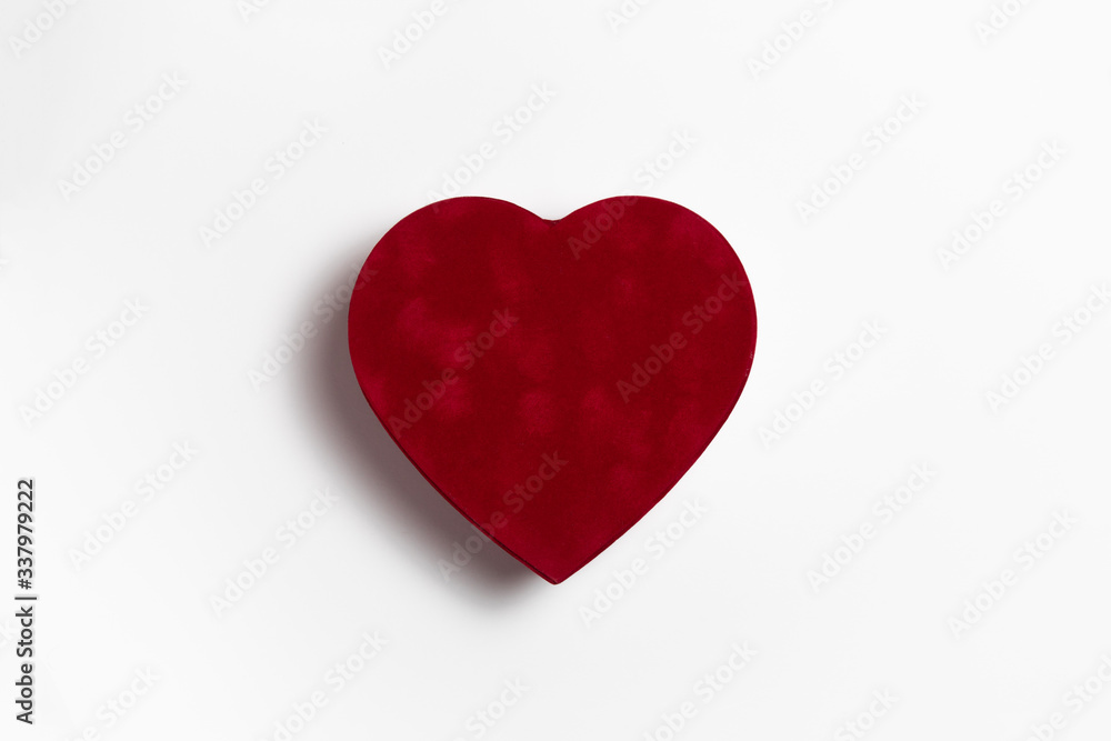 Red Heart Box for Valentine's day or special day in love concept. Closed red gift box with a heart shape isolated on white background. High-resolution photo.Mock-up.