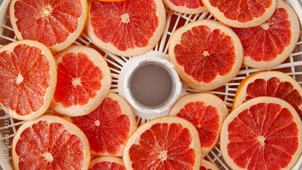 Dried grapefruit on the dryer. Dried grapefruit on the dryer.
