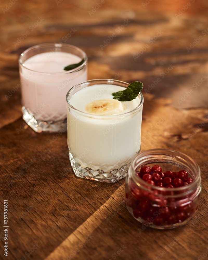 Yogurt on a wooden background. Summer food. Yogurt on a wooden background. Summer food.