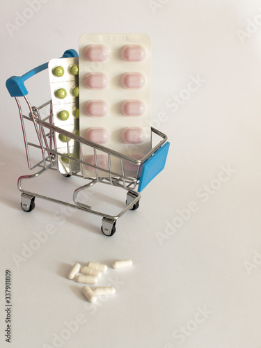 pills in a basket on a white background
