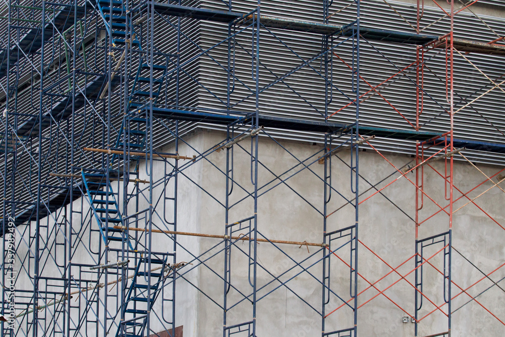Obraz premium Scaffolding for construction with ladder up and down