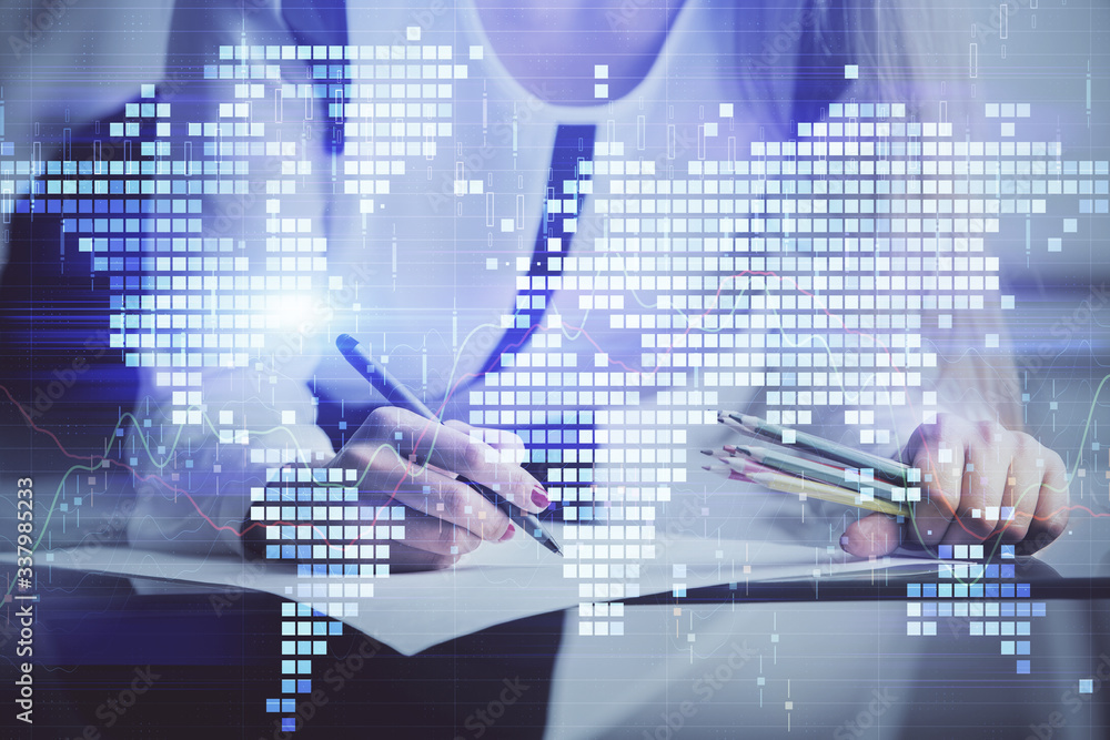 International business hologram over hands taking notes background. Concept of success. Multi exposure International business hologram over hands taking notes background. Concept of success. Multi exposure