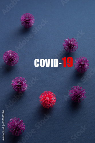 Coronavirus plastic models with inscription COVID-19. Sars-cov-2 pandemic concept COVID-19 pandemic concept 