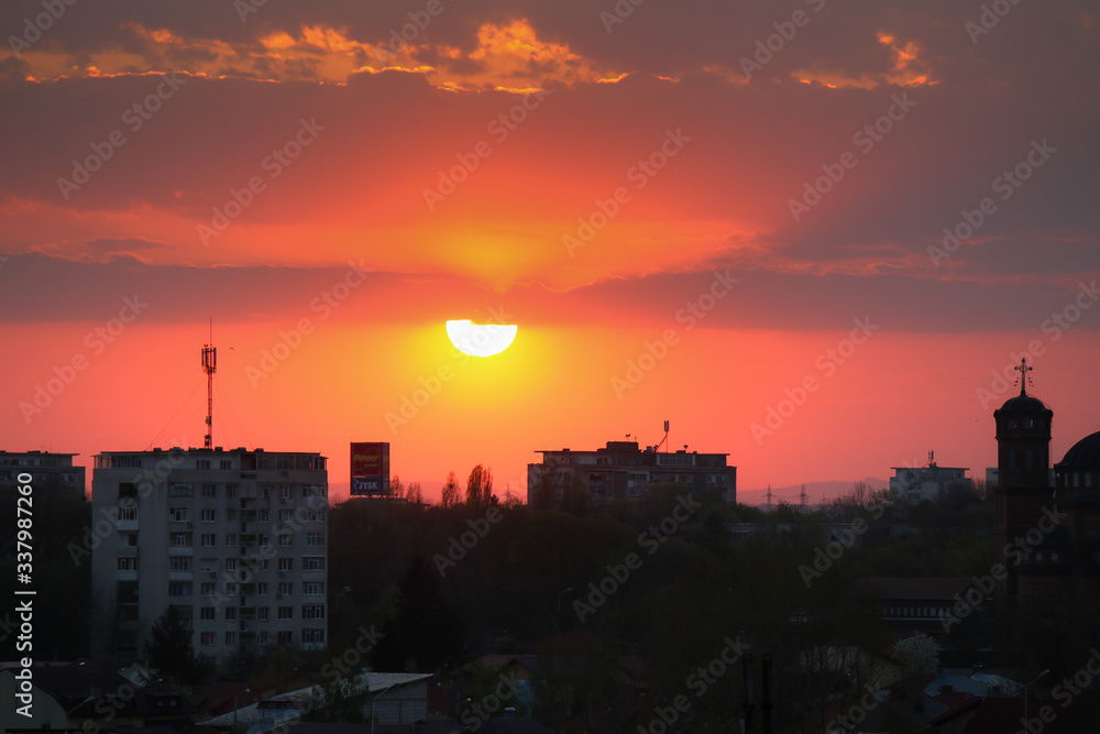 Beautiful sunset above the city skyline  , The city of Ploiesti, Romania with a beautiful sun