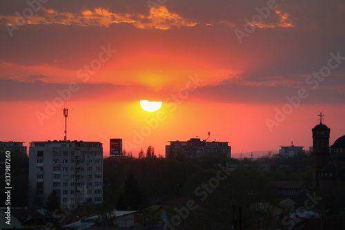 Beautiful sunset above the city skyline    The city of Ploiesti  Romania with a beautiful sun