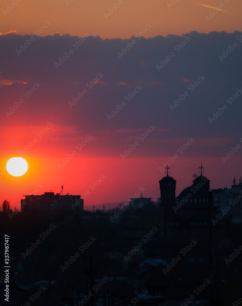 Beautiful sunset above the city skyline  , The city of Ploiesti, Romania with a beautiful sun