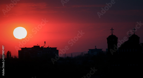 Beautiful sunset above the city skyline  , The city of Ploiesti, Romania with a beautiful sun © Mihai