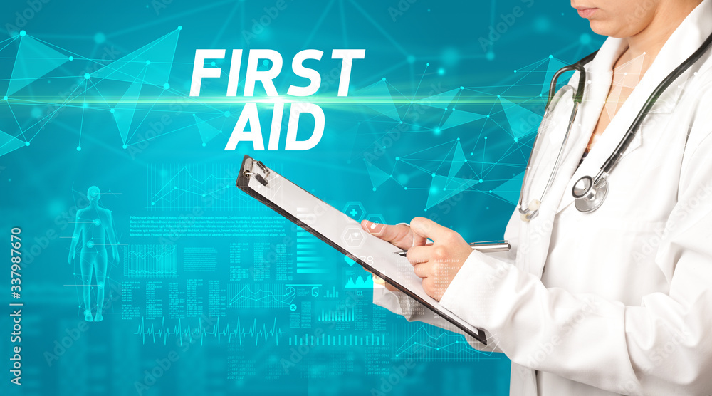 doctor writes notes on the clipboard with FIRST AID inscription, medical diagnosis concept doctor writes notes on the clipboard with FIRST AID inscription, medical diagnosis concept