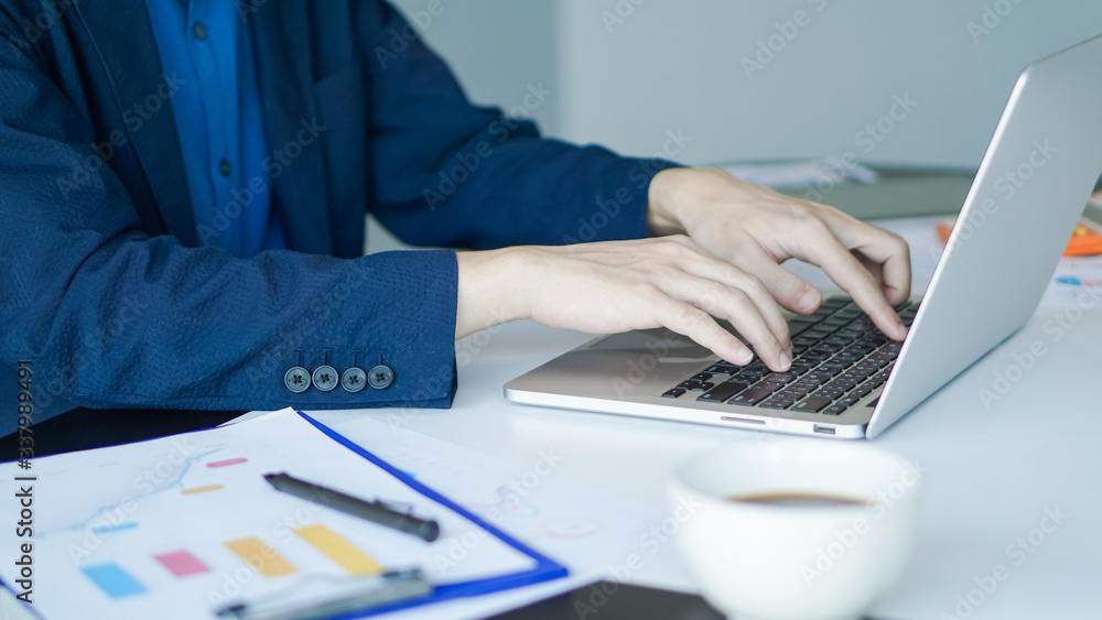 Businessman or accountant working on laptop computer with business document, business financial accounting concept. Businessman or accountant working on laptop computer with business document, business financial accounting concept.