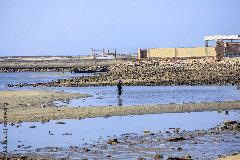 Berbera, Somaliland - November 10, 2019: Local People Swimming in the Warm Water on the Sunny Day