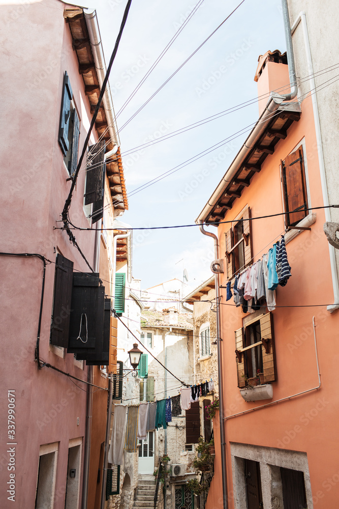 2019, Europe, Croatia, Rovinj. Architecture of old town of Rovinj with clotheslines across the street. Travel, adventure concept. City background.