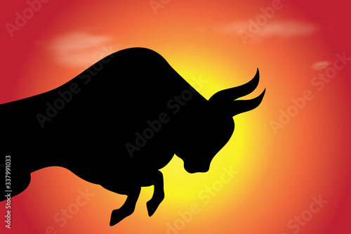 Vector silhouette of bull at sunset. Symbol of cattle.