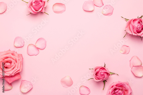 Flower roses frame on pink pastel background. Floral monochrome backdrop for your design
