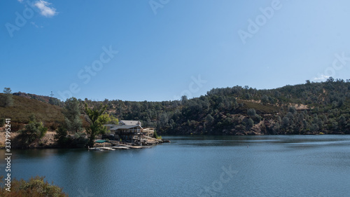 View on the lake with forest and blue sky