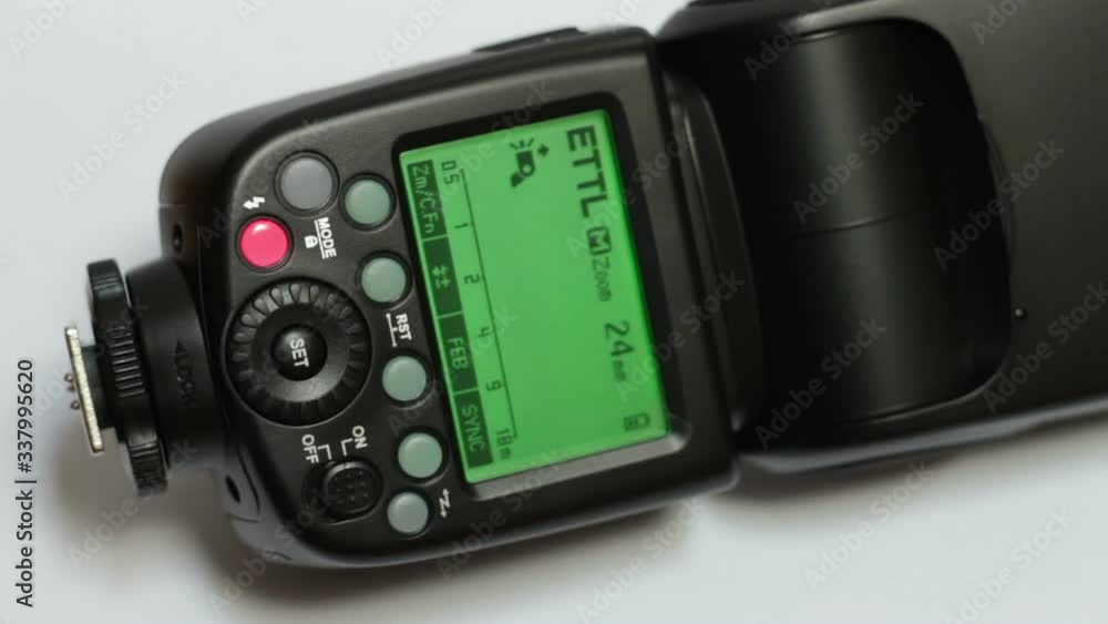 the video shows the hand of a woman who turns off the flash for dslr on a white background
the video shows the hand of a woman who turns off the flash for dslr on a white background