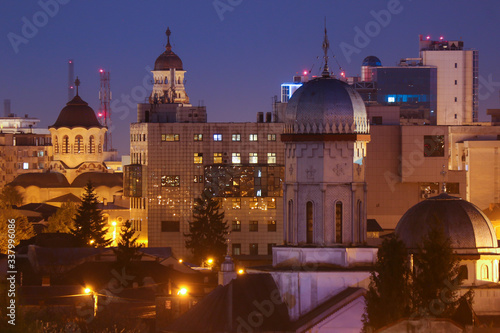 Tablou pe pânză Old city buildings in the dusk , The city of Ploiesti , Romania in the golden li