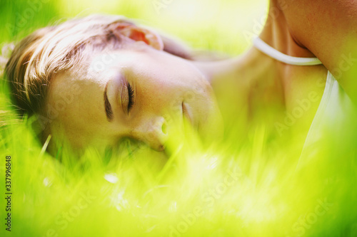 Woman sleep on grass photo