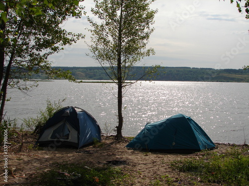 Camping tent in a camping on the river bank