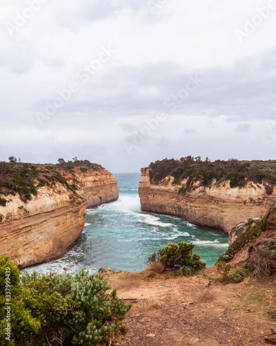 Rock formations with ocean sea waves on coastline. London Arch gorge on Great Ocean Road, Melbourne, Australia. Road trip to Australian coast line. Sand, sea, holiday, vacation. Twelve Apostles