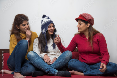 Sisters sharing anecdotes with each other. 
 photo