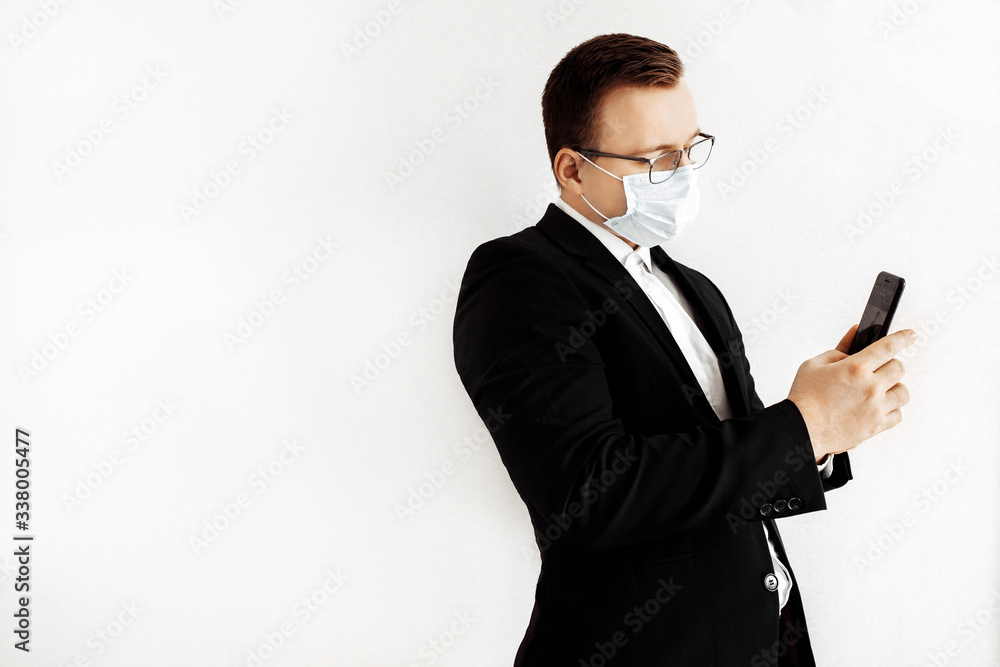 European business man working from home and using medical mask for protect . Concept,contagious disease, coronavirus.
European business man working from home and using medical mask for protect . Concept,contagious disease, coronavirus.