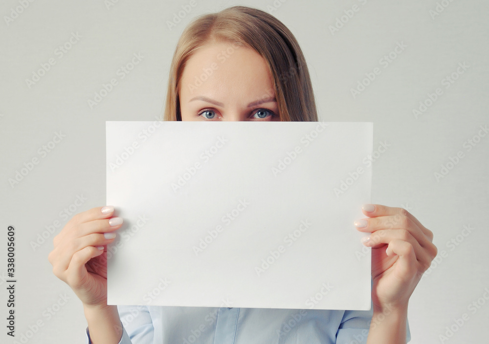 pretty girl with empty paper sheet. Poster with copy-space concept pretty girl with empty paper sheet. Poster with copy-space concept
