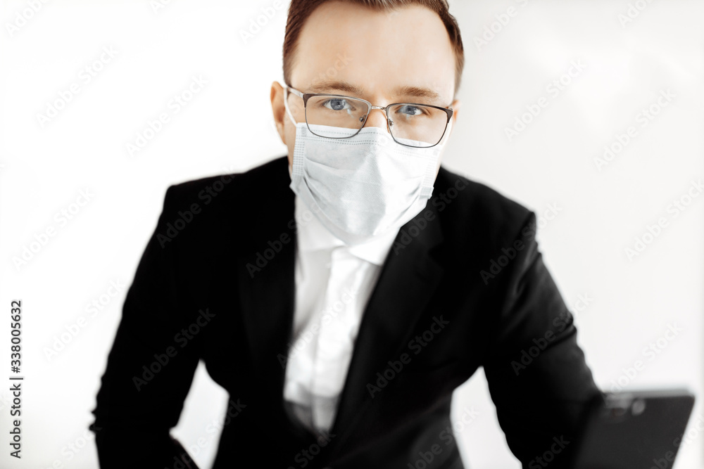 European business man working from home and using medical mask for protect . Concept,contagious disease, coronavirus.
European business man working from home and using medical mask for protect . Concept,contagious disease, coronavirus.