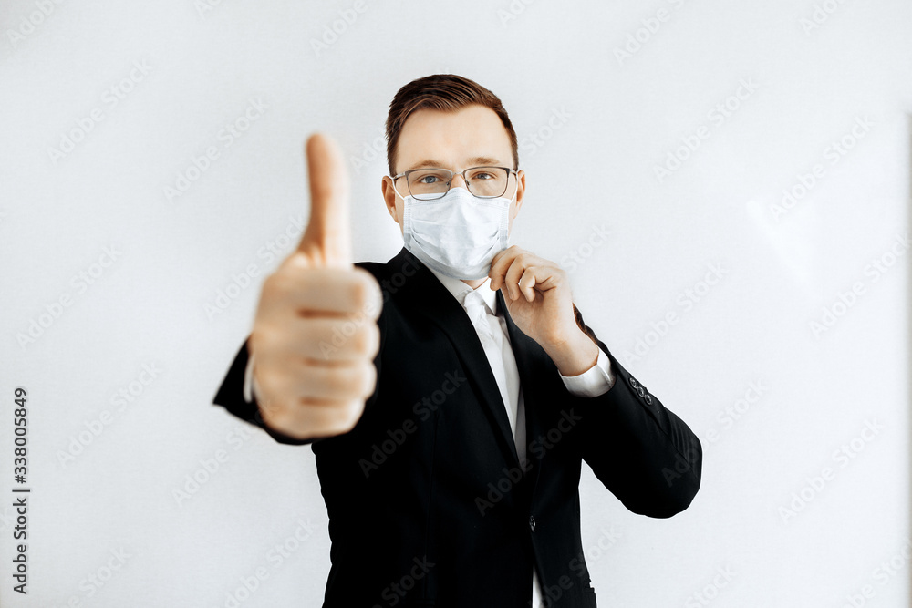Business man wearing medical mask to protect from coronavirus. Concept,contagious disease, Covid-19. Business man wearing medical mask to protect from coronavirus. Concept,contagious disease, Covid-19.