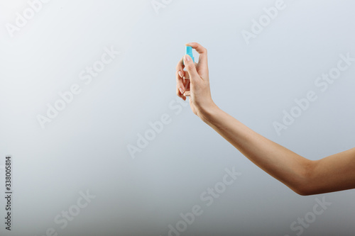 Antibacterial spray for hands antiseptic in hands pattern on white background isolation