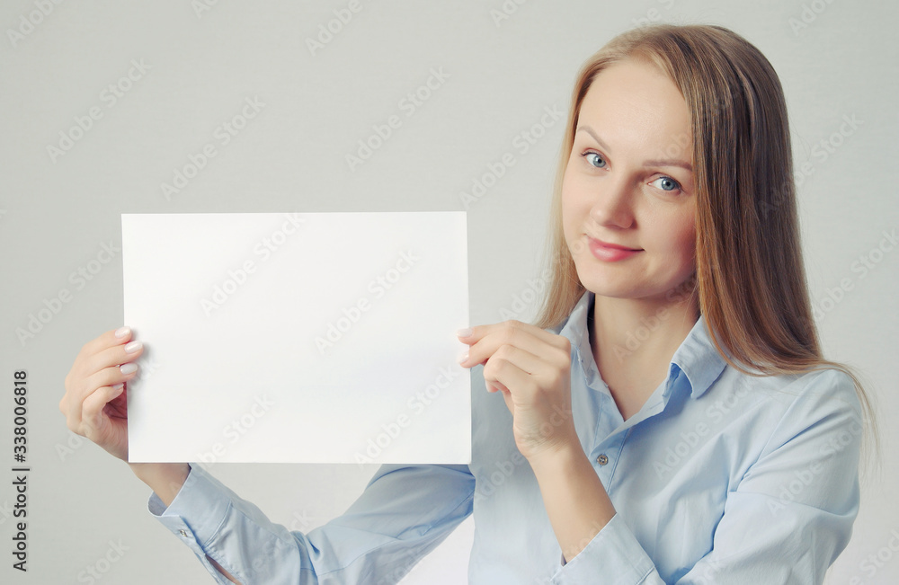 blonde woman with paper sheet. Poster or banner with copy-space concept blonde woman with paper sheet. Poster or banner with copy-space concept