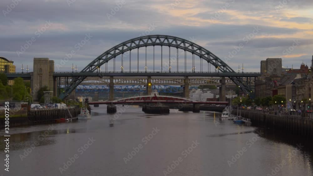Time lapse of the Tyne Bridge, River Tyne and Newcastle Gateshead quayside at sunset, Summer, Newcastle upon Tyne, North East England, UK Time lapse of the Tyne Bridge, River Tyne and Newcastle Gateshead quayside at sunset, Summer, Newcastle upon Tyne, North East England, UK