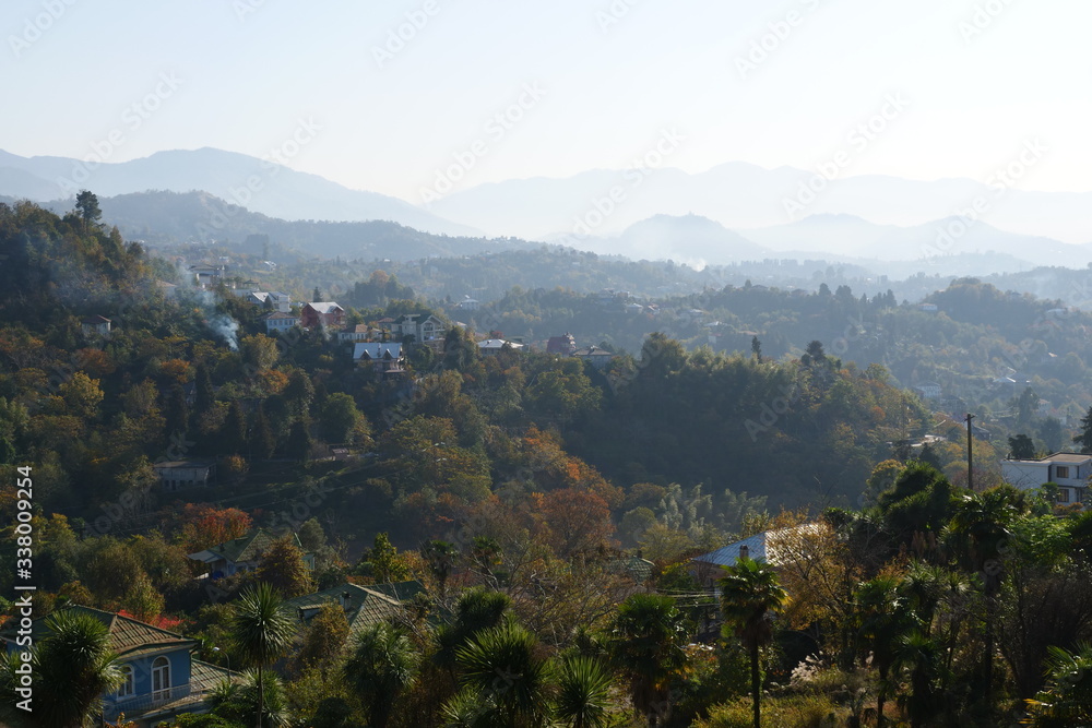 Fototapeta premium A sign with a mountain in the background