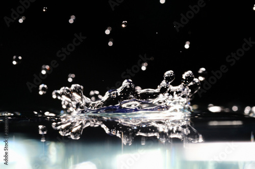 water splash like a crown on a dark blurred background