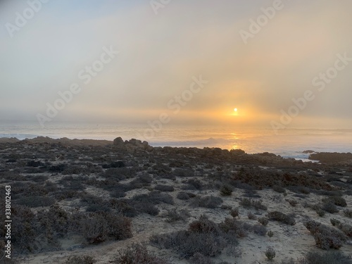 Sunset over wild sea at Noup, West Coast of South AFrica photo