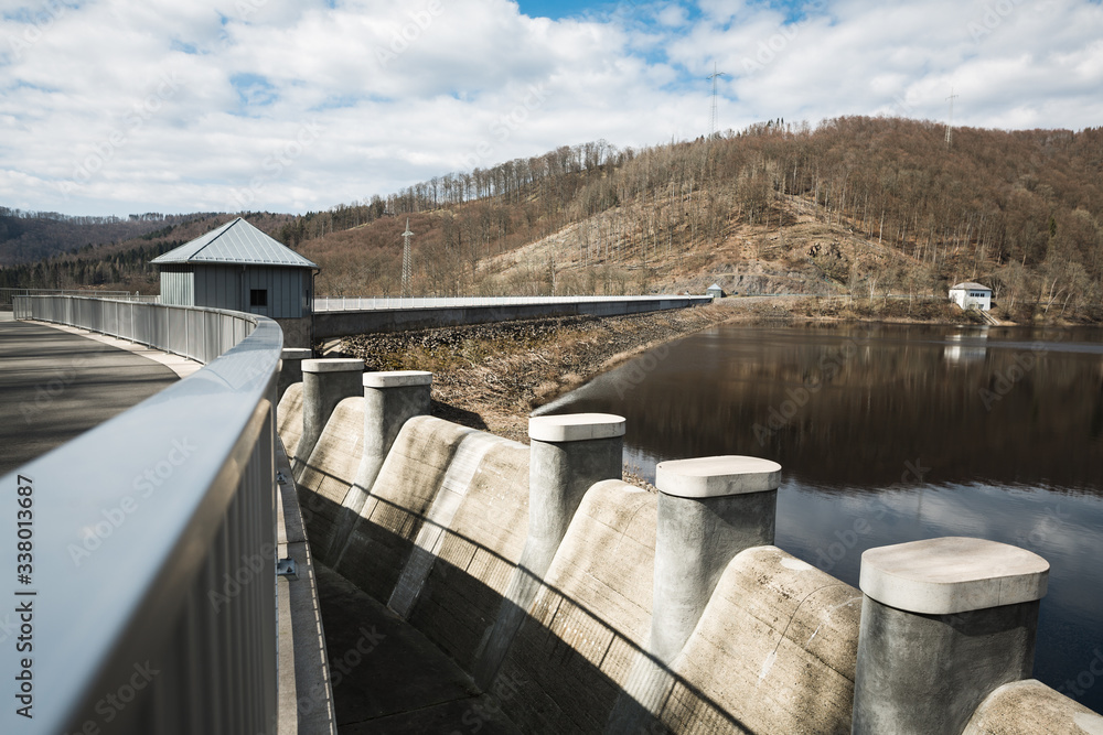 A magnificent view from the dam in the German Harz. Blue sky reflected in water