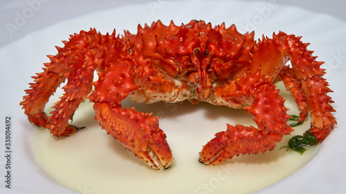 Kamchatka red king crab is boiled in boiling water in a pan.