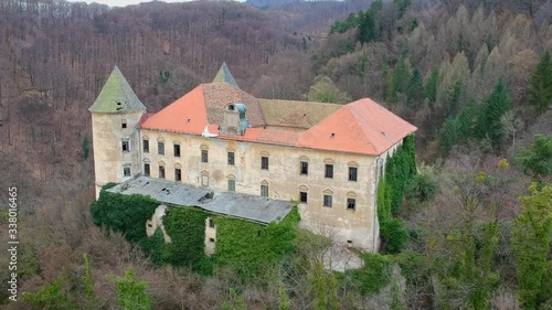 Aerial trucking shot of abandoned Podčetrtek Castle in Slovenia. photo